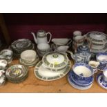 Two shelves of ceramics, including early blue and white Willow pattern, Paragon 'Famous Roses' tea w