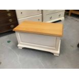 Contemporary white painted blanket box with hinged light oak top, purchased from Hatfields, Colchest