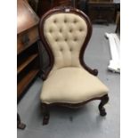 Victorian style nursing chair standing on cabriole legs