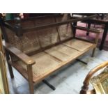 Teak planters two seater bench with caned seat and back and matching elbow chair