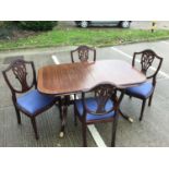 Reproduction Georgian style mahogany extending dining table with one extra leaf, together with six c