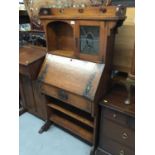 Edwardian art Nouveau oak escritoire bookcase with leaded glazed cupboard, fall flap , drawer and tw