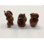 Three Japanese carved boxwood netsukes