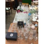 Large collection of antique and later glassware, including cut glass, decanters, coloured glass, etc