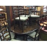 Ercol elm dropleaf dining table and six matching chairs