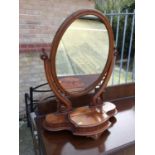 Victorian Mahogany toilet mirror with oval glass plate and carved scroll supports