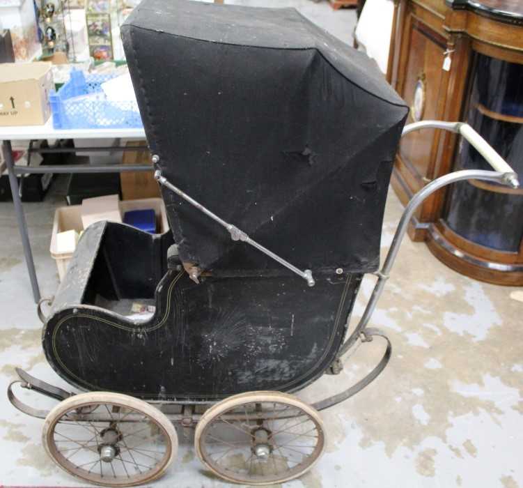 Early 20th Century pram with wire wheels, black painted wooden body and canvas hood, by Hitchings of