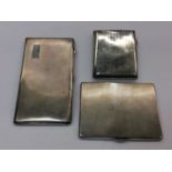 Three silver cigarette cases