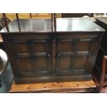 Pair Ercol elm cupboards with panelled doors 99 cm wide, 71 cm high
