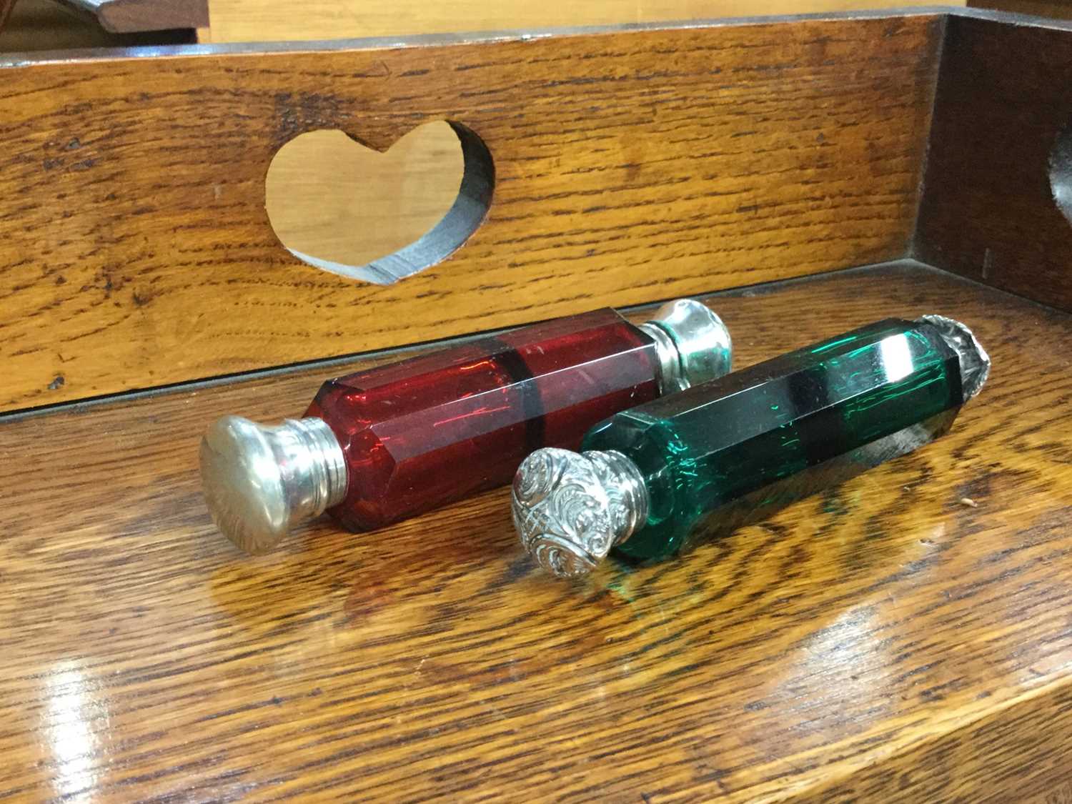 Victorian cranberry glass scent bottle together with another emerald green glass scent bottle (2)