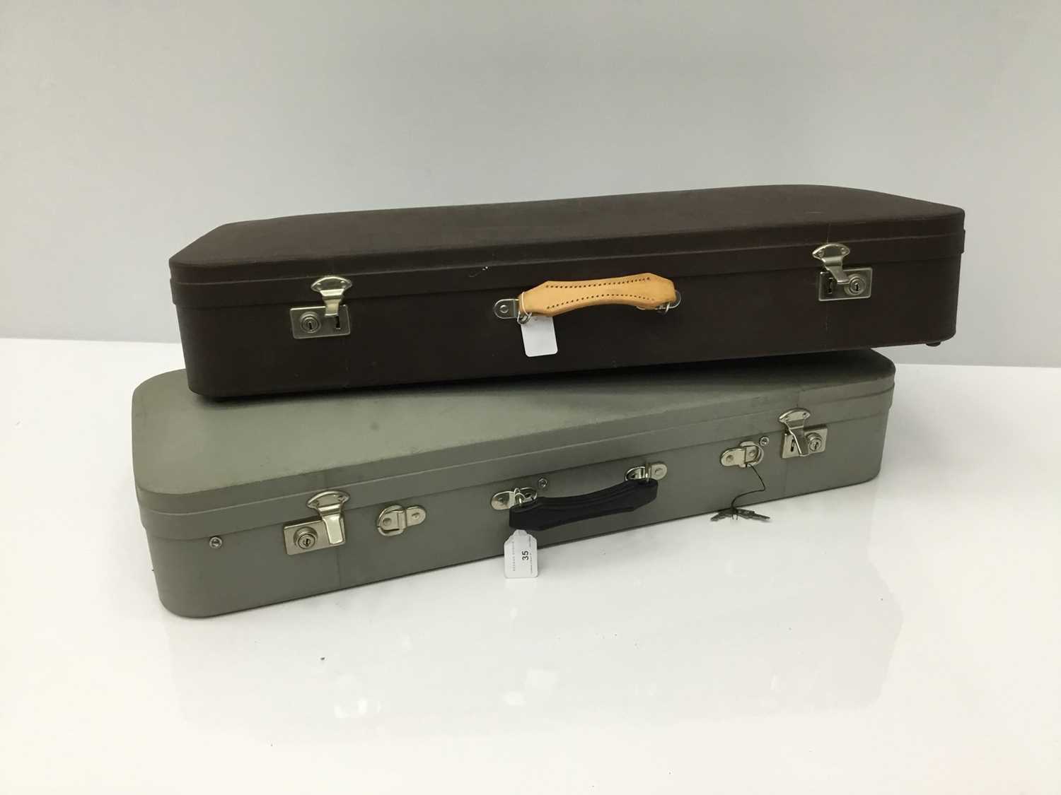 Good quality violin case by Paxman Ltd., grey finish and silk lined fitted interior, together with a