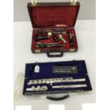 Earlham silvered flute, cased, as new condition, together with Rudall Carte / Boosey and Hawkes clar