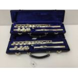 Two Earlham silvered flutes, cased and as new