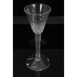 Georgian wine glass, c.1755, the hammered pointed round funnel bowl on a fine incised twist stem, on