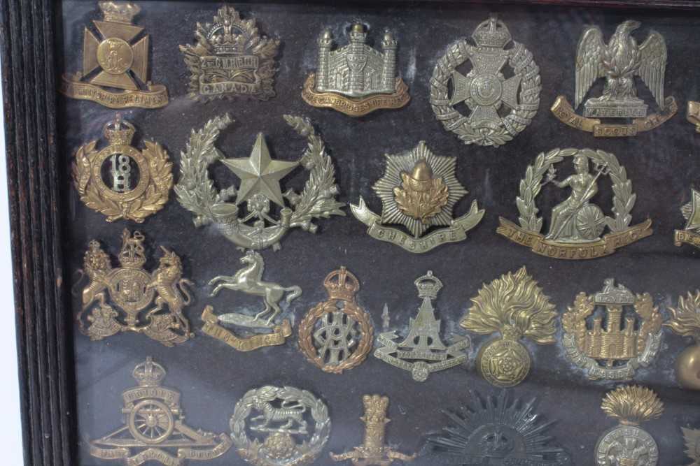 Group of First World War Military cap badges mounted in a glazed frame - Image 2 of 3