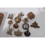Group of cap badges and military buttons to include King's Own Malta Regiment, Inniskilling Fusilier