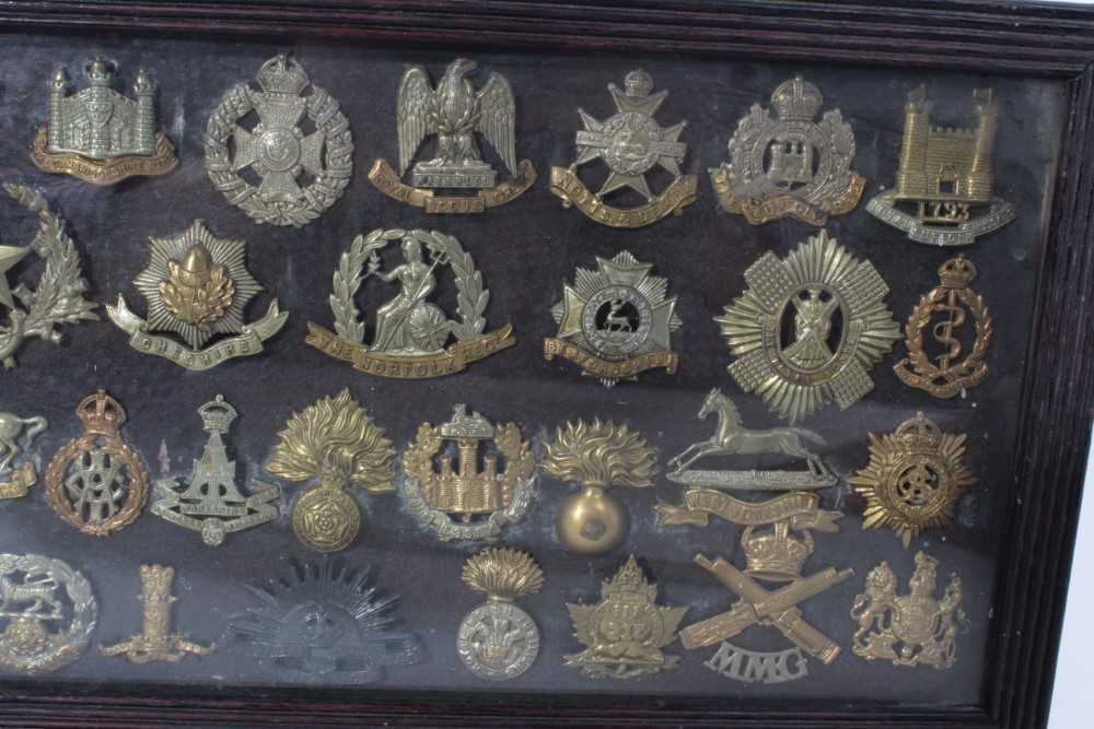 Group of First World War Military cap badges mounted in a glazed frame - Image 3 of 3