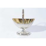 George III silver sugar basket of navette form with reeded borders, swing handle and gilded interior