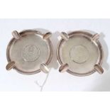 Pair of Chinese silver ashtrays of circular form set with coins on a planished ground, marked Y C Le