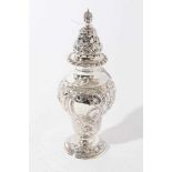 Good quality George V silver sugar castor with ornate embossed foliate and fruit decoration, raised