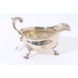 Victorian silver sauce boat with gadrooned border on three scroll legs with shell feetLarge Victoria