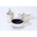 George V silver three piece cruet set comprising mustard pot of oval form with domed hinged cover, b