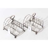 Pair of impressive Victorian Regimental silver six division toast racks of arched form, the loop han