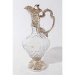 Victorian style cut glass claret jug of bulbous form, with facet cut decoration, silver mount with e