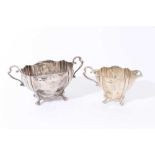 Edwardian silver two handled sugar bowl with fluted decoration, engraved armorial and scroll handles