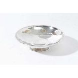 George V Arts and Crafts silver pin dish of circular form with planished finish on circular foot, (L