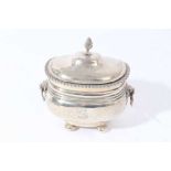 Edwardian silver tea caddy of oval cauldron form with reeded bands and and engraved armorial, domed