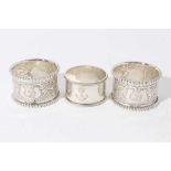Pair of late Victorian silver napkin rings with chased decoration and beaded borders, (Sheffield 190