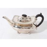 Edwardian silver teapot of cauldron form with gadrooned and shell border, domed hinged cover with eb