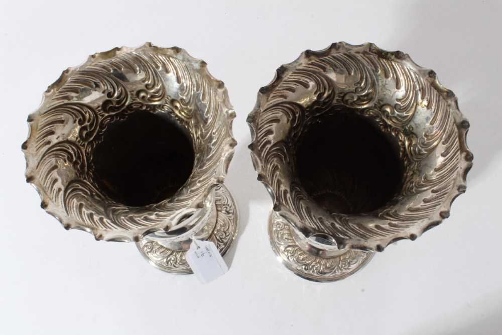 Pair of Edwardian silver spill vases, with embossed decoration scroll decoration and flared rims, ra - Image 7 of 7