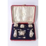 George VI six piece silver cruet set comprising two mustard pots of baluster form with decorative bo