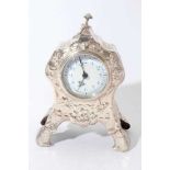 Edwardian Art Nouveau silver mantel clock in a decorative case with embossed floral and foliate deco