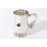 George II silver tankard of baluster form with scroll handle, on a circular foot, (London 1748), mak