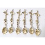 Set of six good quality white metal cast spoons in the form of branches with leaves, with gilded fin