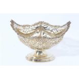 Victorian silver gilt bon bon dish of navette form, with embossed swags and pierced decoration raise