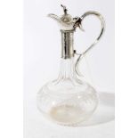 Victorian silver mounted glass claret jug of onion form with star cut base, wheel engraved and etche
