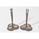 Pair of early 20th century American silver bud vase holders, pierced tapered stems with floral decor