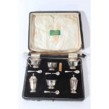 George V silver six piece cruet set comprising two salt cellars, two pepperettes, two mustard pots (