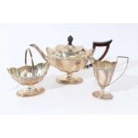 Late Victorian silver three piece bachelor's tea set of navette form, the teapot with ebony finial a
