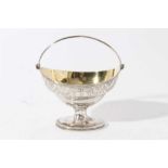 George III silver sugar basket of navette form with brite cut engraved decoration, engraved armorial