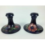 Pair of Moorcroft pottery candlesticks decorated in the Anemone pattern, impressed marks and origina