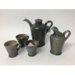 Five pieces of Rebecca Harvey salt glazed studio pottery including coffee pot with lid, 16.5cm high,