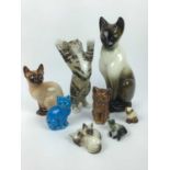 Eight model cats including Royal Doulton, Sylvac and Winstanley