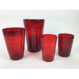 Four Whitefriars Ruby red wave ribbed vases, 25cm, 20cm, 15.5cm and 15.5cm