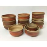 Collection of Jane Hamlyn rust coloured studio pottery including six soup bowls, six pudding bowls a