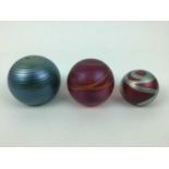 Three Okra art glass paperweights by Richard Goulding (3)